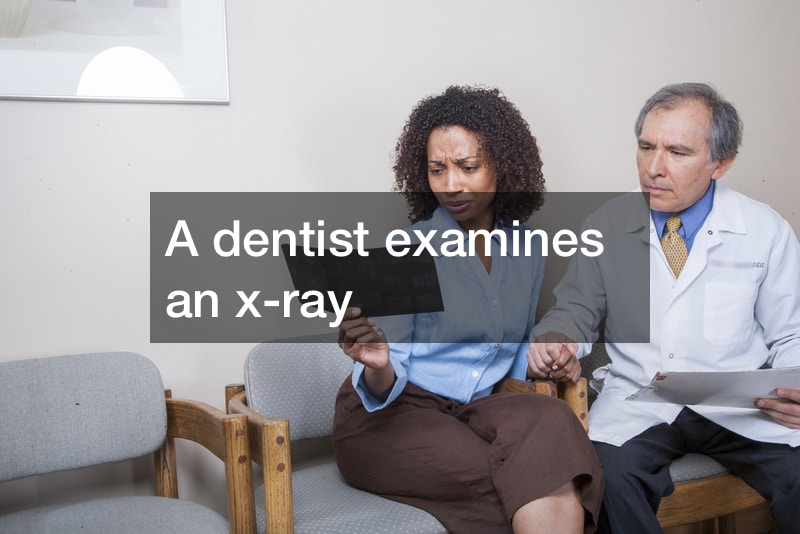 Woman-at-dental-clinic-examines-x-ray.jpeg